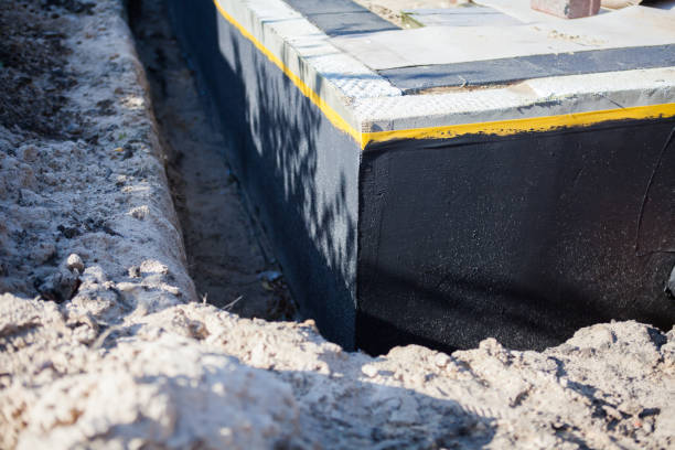 Professional Basement Waterproofing technician working in Great Mills, MD